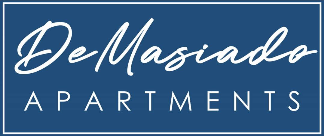 A blue sign with the words "DeMasiado Apartments" written in white cursive.